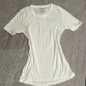 basic white top that is very breathable and stretchy but is too big for me